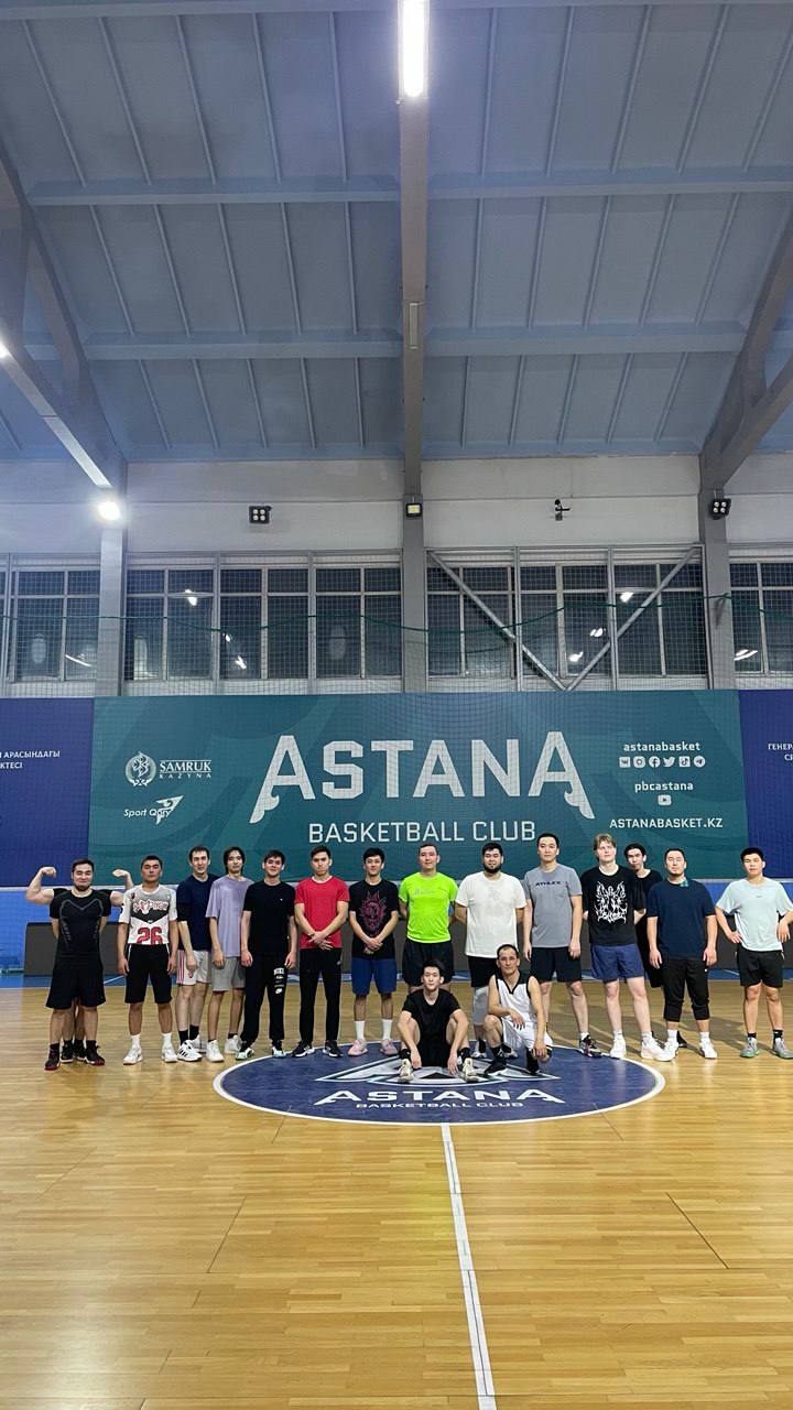 Команда в зале перед баннером Astana Basketball Club